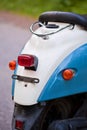 Rear wing and headlight of blue retro scooter Royalty Free Stock Photo