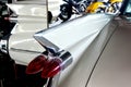 The rear wing of a white 1959 retro car, reflected in the mirrors, close-up Royalty Free Stock Photo