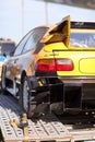 Rearlights of yellow sport car with black diffuser