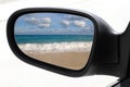 Rearview car mirror tropical caribbean beach