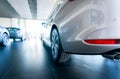 Rearview car parked in luxury showroom. Car dealership office. New car parked in modern showroom. Car for sale and rent business Royalty Free Stock Photo