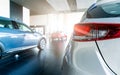 Rearview car parked in luxury showroom. Car dealership office. New car parked in modern showroom. Car for sale and rent business Royalty Free Stock Photo