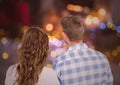 Rearview of couple looking at night bokeh Royalty Free Stock Photo