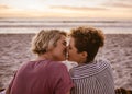 Romantic young lesbian couple kissing during a beach sunset Royalty Free Stock Photo