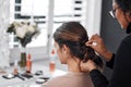 I have to look my best for this special day. Rearview shot of a woman getting her hair done by her hairstylist. Royalty Free Stock Photo