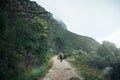 Wander often, wonder always. Rearview shot of a young man hiking through the mountains.