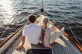 Rearview of two mature people sitting on a yacht