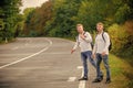 Reason people pick up hitchhikers. Missed their bus. Need help. Cheap transport. Transport problem. Travel and transport Royalty Free Stock Photo