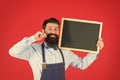 Reasonable prices. menu board. bearded hipster cook in apron. great cuisine. cooking by recipe. welcome. Restaurant or