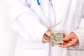 reatment costs in India, Private medical practice, doctors illegal income, bribe for treatment, Concept. The doctor counts the Royalty Free Stock Photo