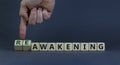 Reawakening symbol. Businessman turns cubes and changes the word `awakening` to `reawakening`. Beautiful grey background, copy Royalty Free Stock Photo