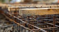 The rebar framework taking shape underneath a layer of wooden boards preparing for concrete to be poured