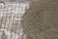 Rebar grids in a concrete floor during a pour.