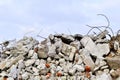 The rebar sticking up from piles of brick rubble, stone and concrete rubble.