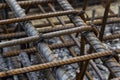 Rebar tie wire work at construction site. Steel bars reinforcing for reinforced concrete and building structures