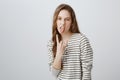 Rebel teenager stand against rules and control. Portrait of cool and confident girl with fair hair sticking out tongue Royalty Free Stock Photo