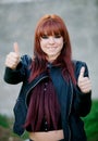 Rebellious teenager girl with red hair saying Ok Royalty Free Stock Photo