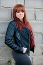 Rebellious teenager girl with red hair smiling Royalty Free Stock Photo