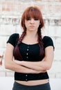 Rebellious teenager girl with red hair Royalty Free Stock Photo