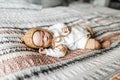 Reborn baby doll lying on a bed Royalty Free Stock Photo