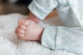 Reborn doll boy. small legs close up.