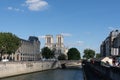 Cathedral Notre-Dame de Paris, prefecture de police court and the Petit Pont Cardinal Lustiger viewed from the seine river cruise.