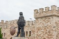 See Kaloyanova castle hotel fortress with parapets and King Kaloyan statue in Arbanasi, Bulgaria. Royalty Free Stock Photo