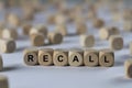 Recall - cube with letters, sign with wooden cubes