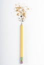 Recently sharpened pencil with wood shavings and mine on a white table Royalty Free Stock Photo