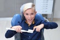 Reception at the children`s dentist. The boy learns to brush his teeth correctly. Portrait of a boy with a toothbrush in his hand