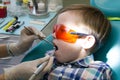 Reception at the dentistry. The dentist examines the oral cavity. Close up