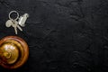 Reception desk in hotel with ring and keys dark background top v