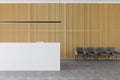 Reception desk in wooden office hall, armchairs