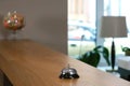 Reception at the hotel with a bell on a wooden table, closeup view. Royalty Free Stock Photo