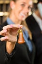 Reception in Hotel - woman with key Royalty Free Stock Photo