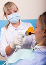 The reception was at the female dentist. Doctor examines the oral cavity on tooth decay. Royalty Free Stock Photo