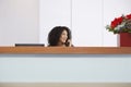 Receptionist On Call Behind Reception Desk Royalty Free Stock Photo