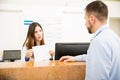 Receptionist explaining services to patient Royalty Free Stock Photo