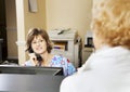 Receptionist Greets Patient Royalty Free Stock Photo