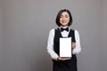 Receptionist holding tablet white screen