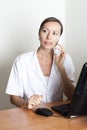 Receptionist on phone in clinic