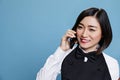 Receptionist speaking on smartphone Royalty Free Stock Photo