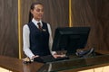 Receptionist working on computer in the hotel Royalty Free Stock Photo