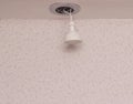 Recessed downlight with LED energy saving bulb, close-up, installation, copy space, modern Royalty Free Stock Photo