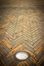 Recessed floor lamp on terracotta floor - image with copy space