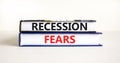 Recession fears symbol. Concept words Recession fears on books on a beautiful white table white background. Business and recession
