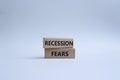 Recession fears symbol. Concept words Recession fears on wooden blocks. Beautiful white background. Business and Recession fears