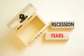 Recession fears symbol. Concept words Recession fears on wooden blocks on a beautiful white table white background. Empty wooden