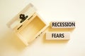 Recession fears symbol. Concept words Recession fears on wooden blocks on a beautiful white table white background. Empty wooden