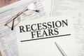 Recession fears symbol. Words on white paper with tax forms Royalty Free Stock Photo